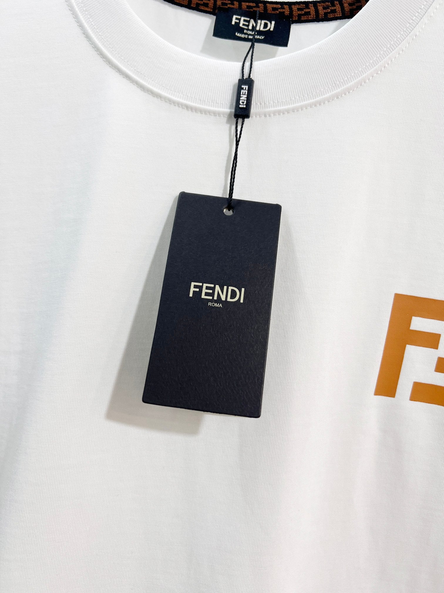 Fendi white short-sleeve T-shirt with FENDI tag at the neck