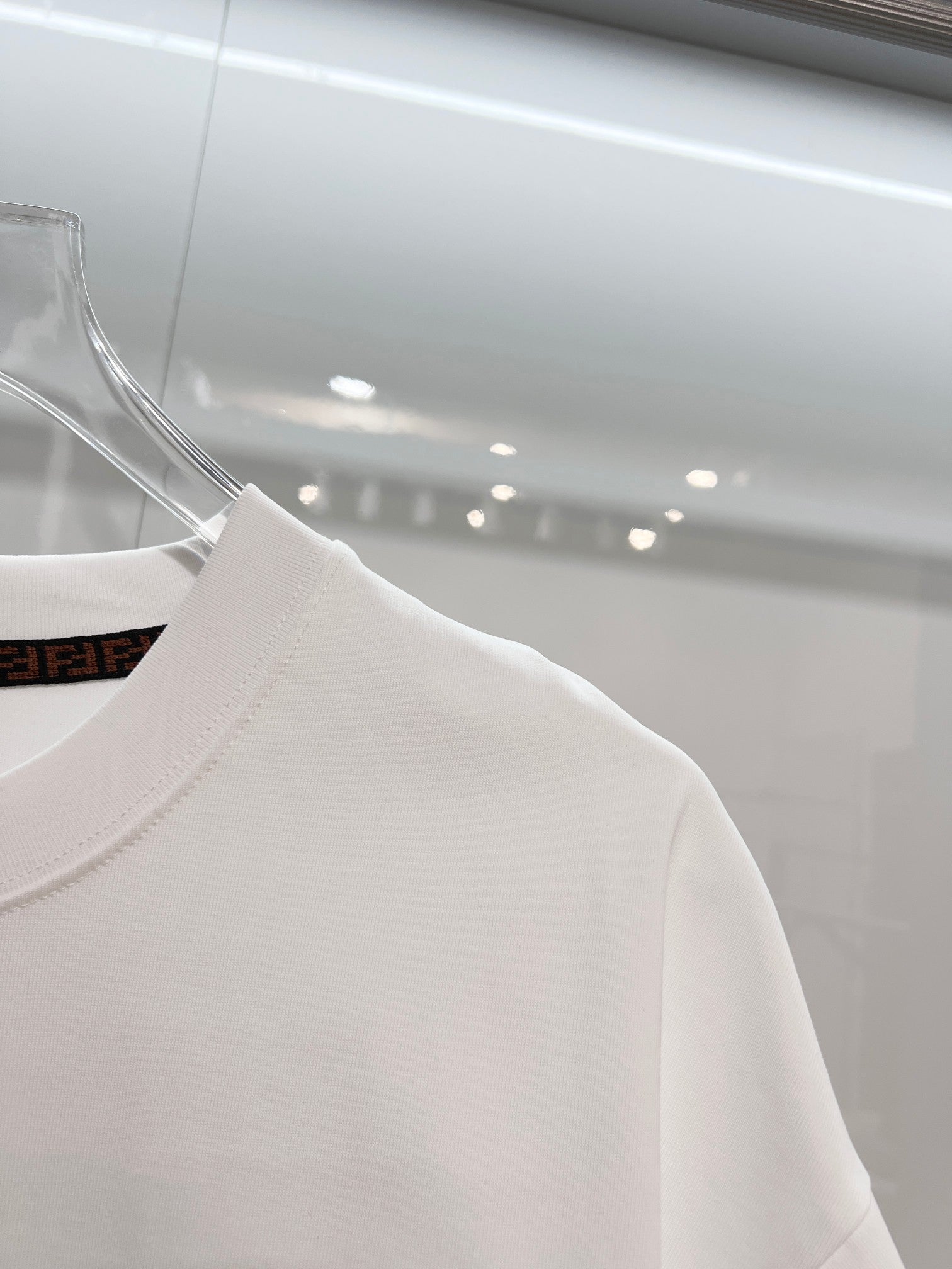 Fendi white short-sleeve T-shirt showing left shoulder and crew neck
