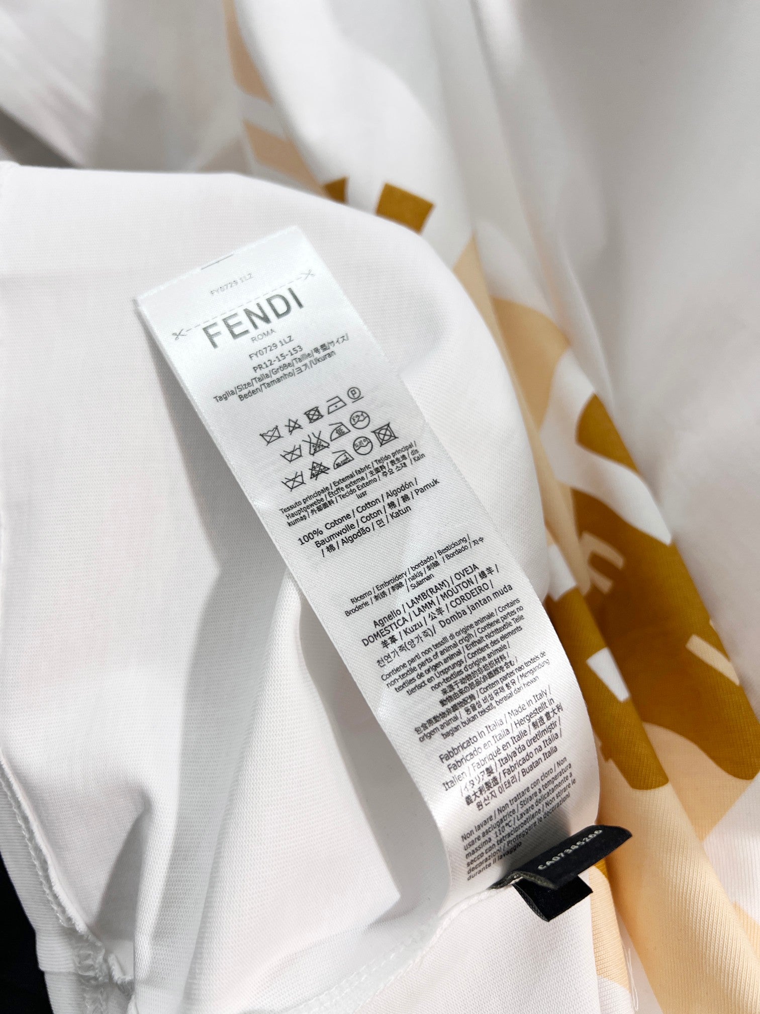 Fendi white short-sleeve T-shirt with care label tag near the side seam