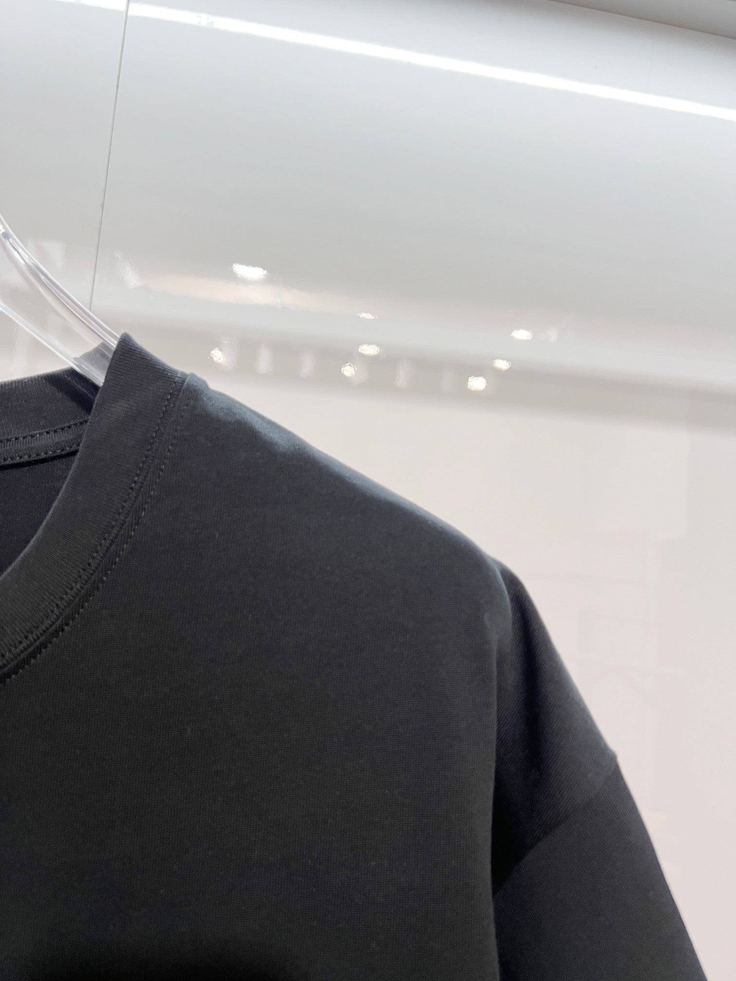 Louis Vuitton black T-shirt shoulder and sleeve close-up