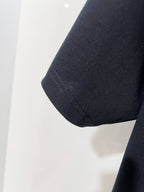 Louis Vuitton black T-shirt sleeve hem close-up