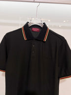 Gucci black polo shirt front view with striped collar trim