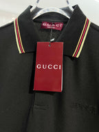Gucci black polo shirt close-up of collar and hanging tag
