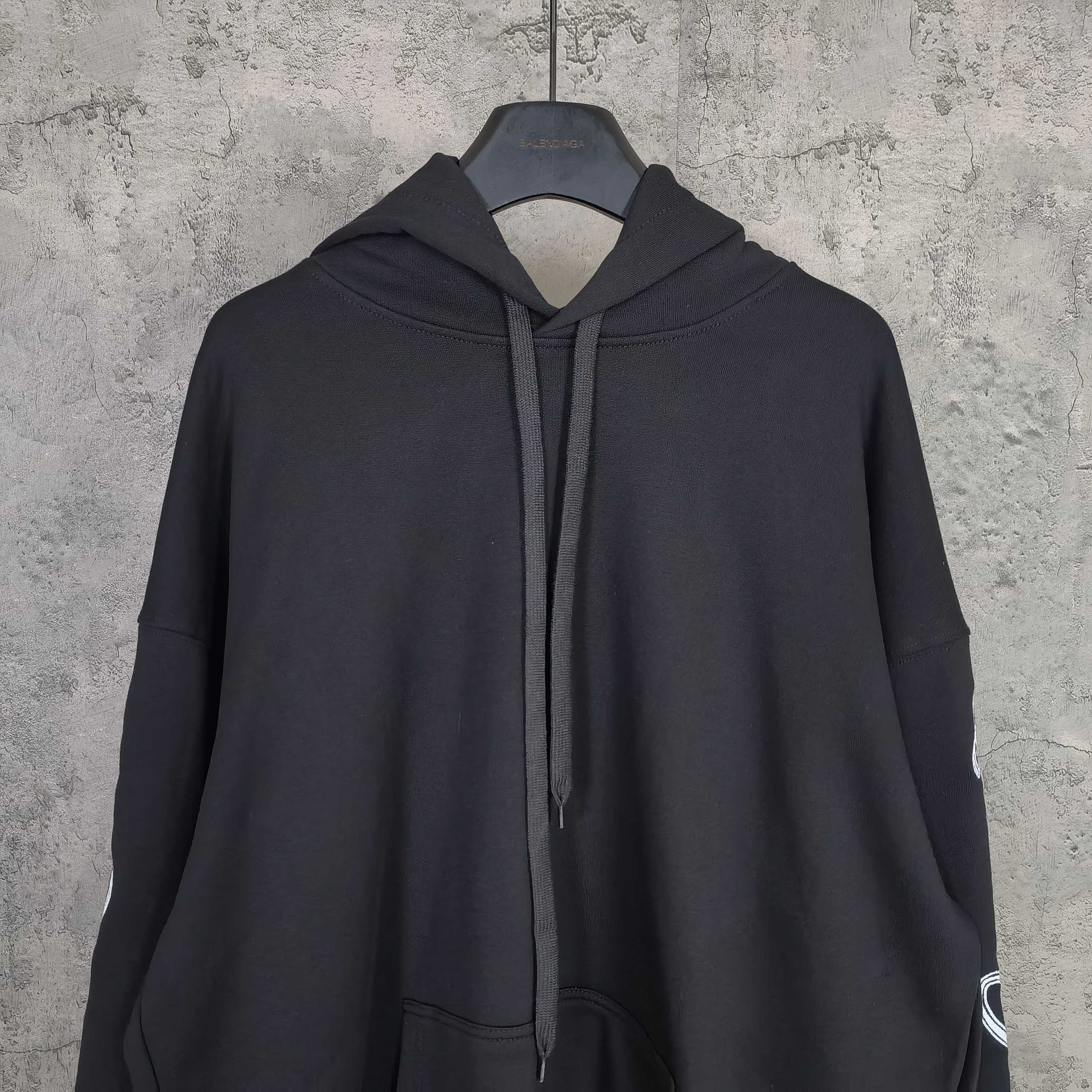 Balenciaga black hoodie front view with hood and drawstring, no visible logo