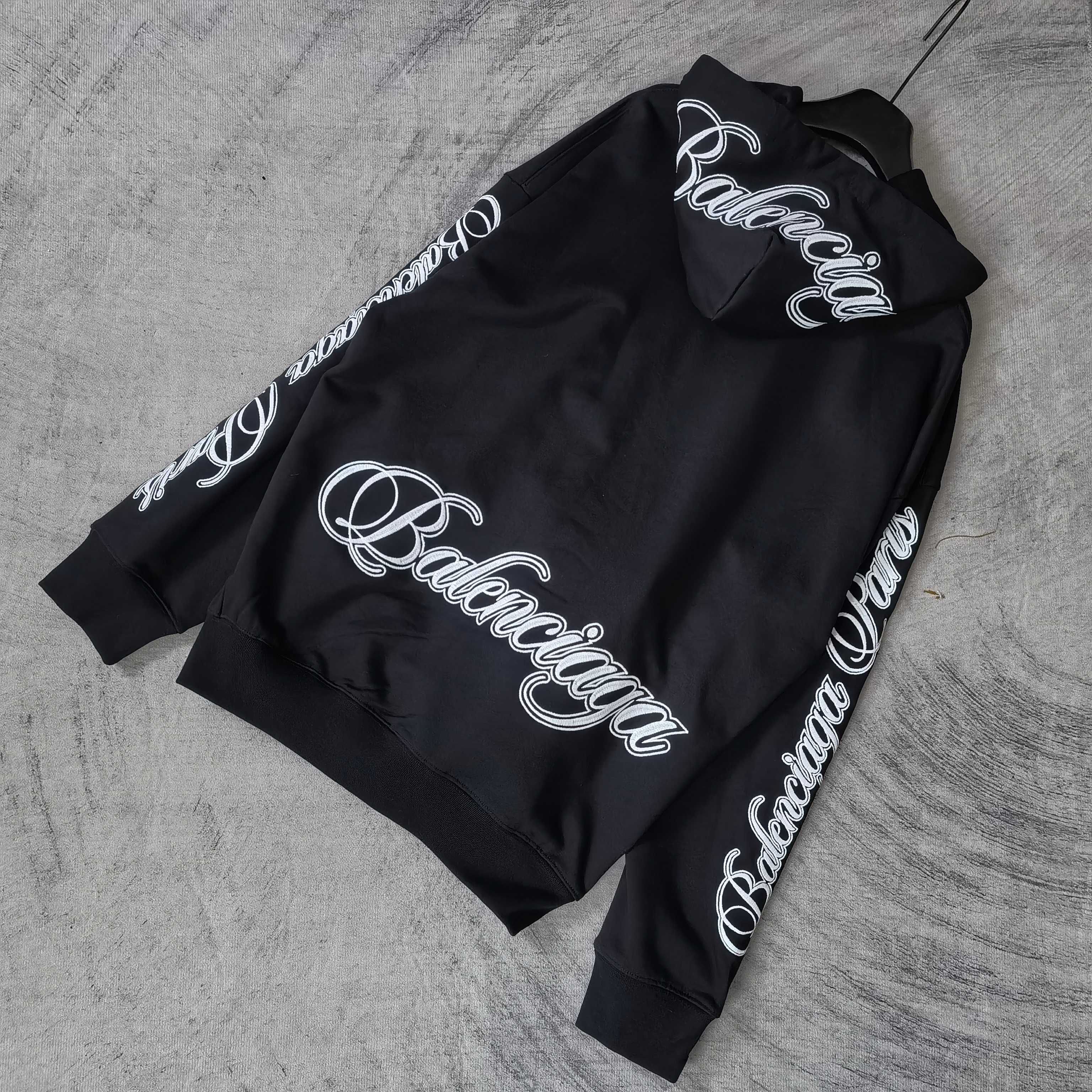 Balenciaga black hoodie with back logo and logo text along the sleeves