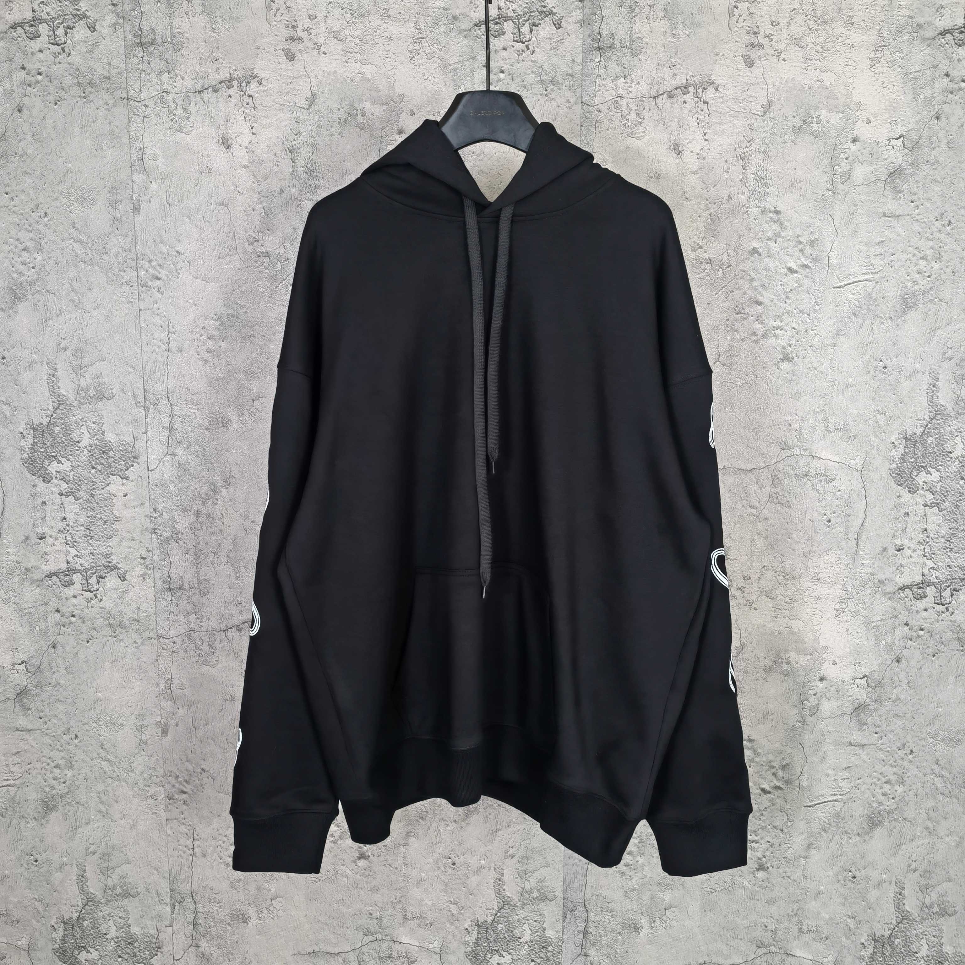 Balenciaga black hoodie with front hood and drawstring, no visible logo