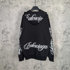 Balenciaga black hoodie with large back logo and logo text on sleeves