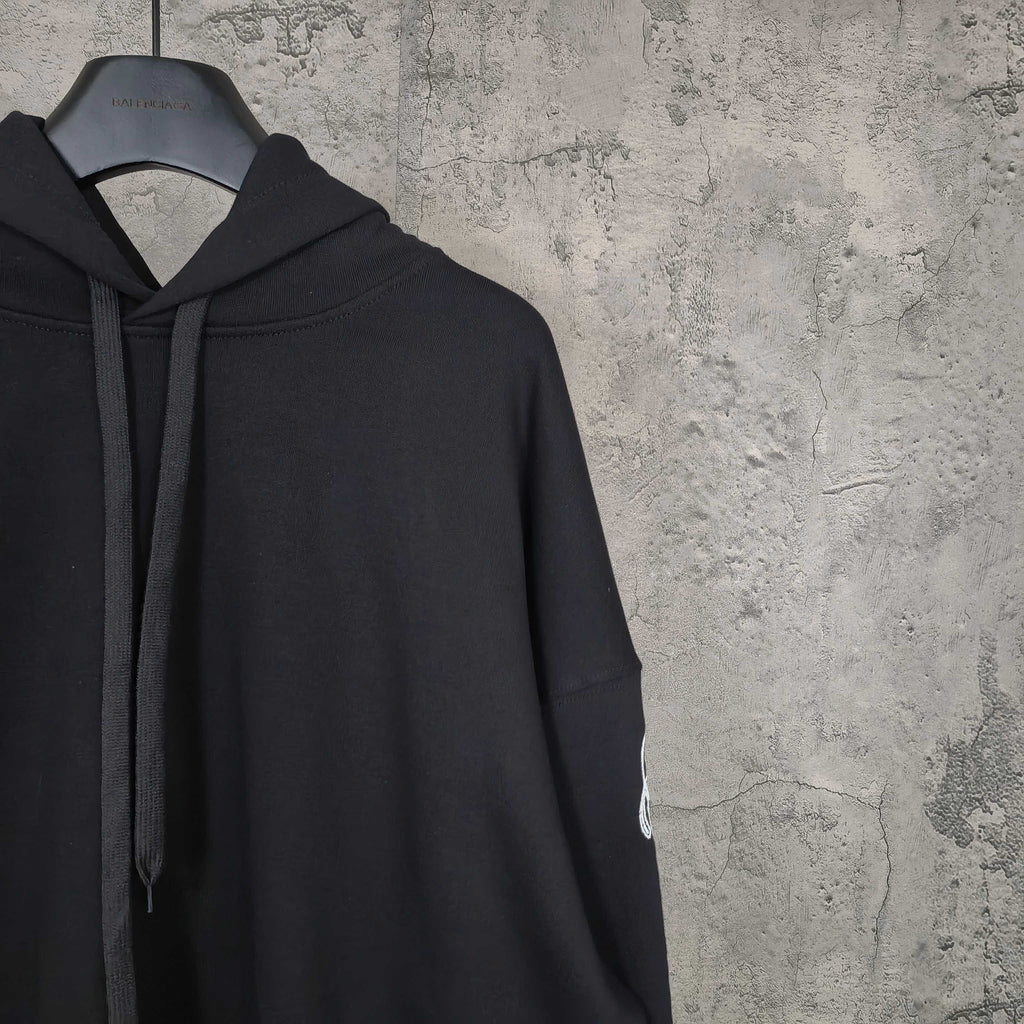 Balenciaga black hoodie side view with hood and drawstring