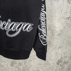 Black Balenciaga sweatshirt sleeve with white script logo