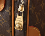 Louis Vuitton bag clasp and zipper pull with engraved logo on brown canvas