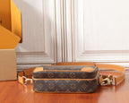 Louis Vuitton mini crossbody bag with long tan strap and brown monogram canvas