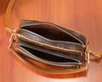Louis Vuitton bag showing two zipper compartments on monogram canvas