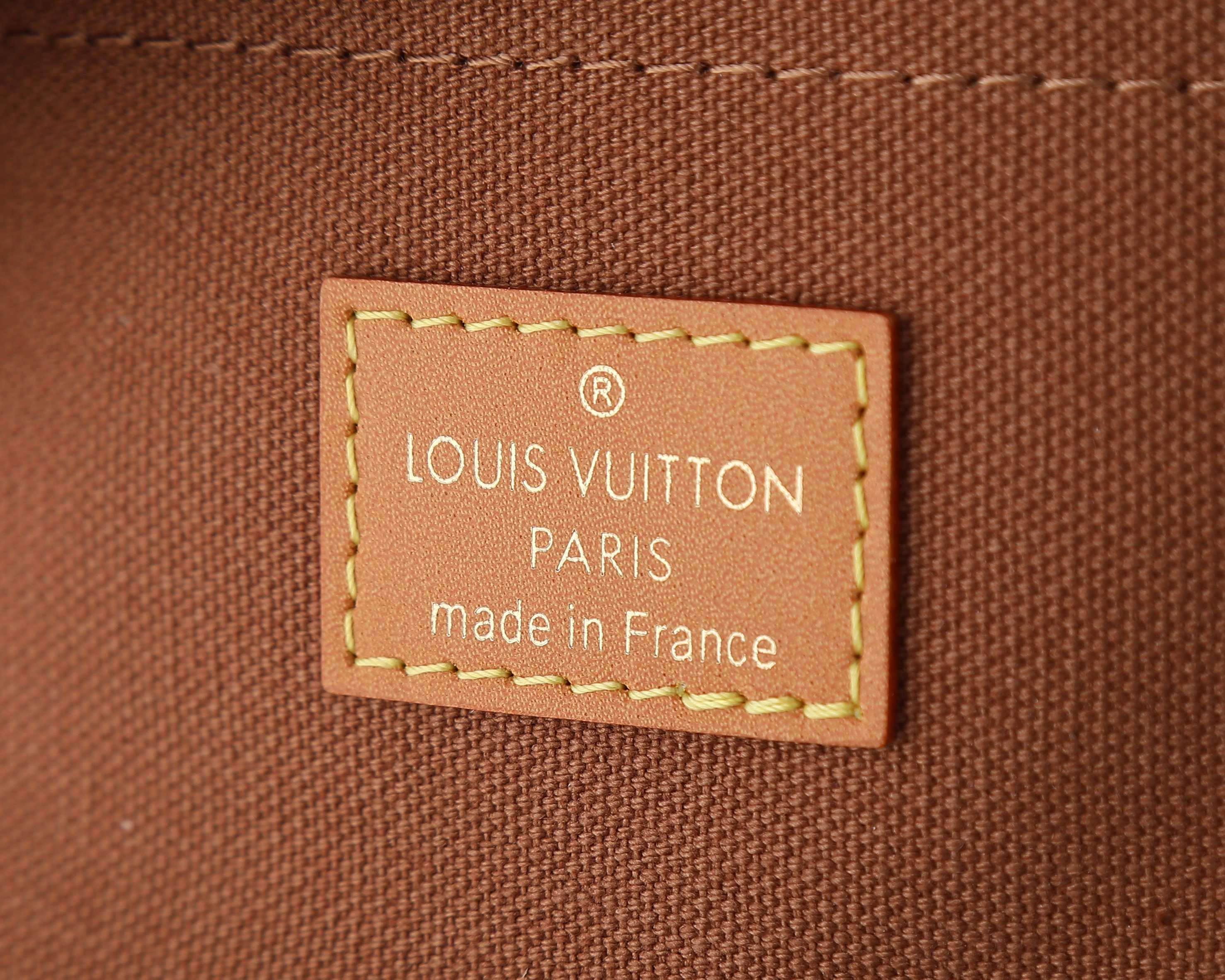 Louis Vuitton Paris made in France fabric label on brown bag