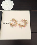 Pair of gold-tone hoop earrings with pastel crystals and pearl drops