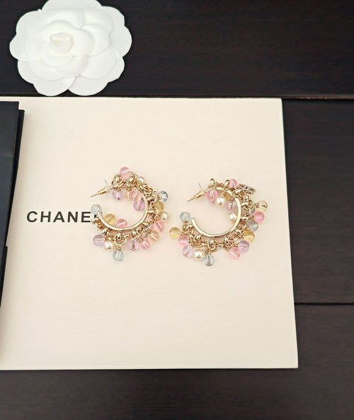 Pair of gold-tone hoop earrings with pastel crystals and pearl drops