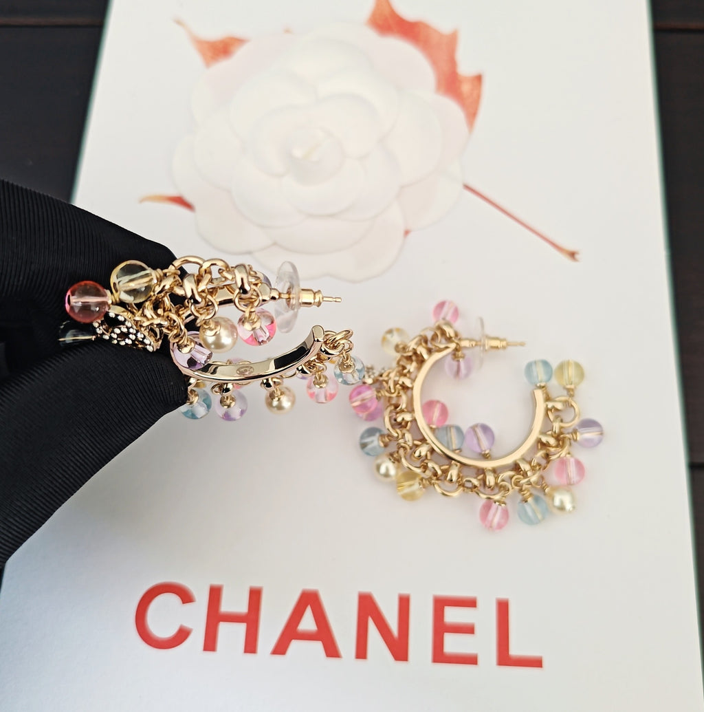Gold-tone hoop earrings with pastel bead and crystal fringe