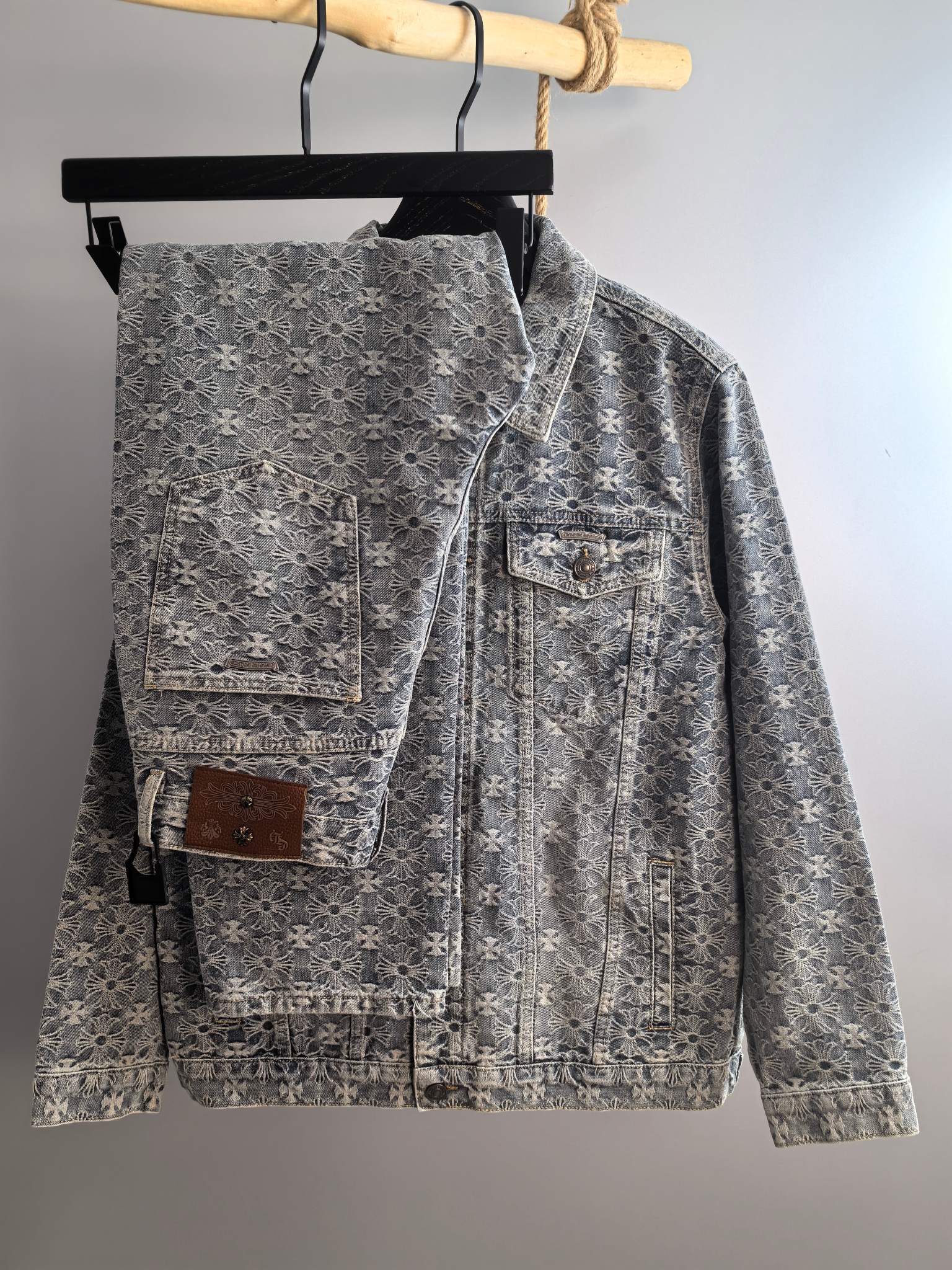 Gray long-sleeve denim jacket with light floral pattern, button front, chest flap pockets