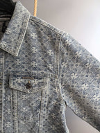 Gray embroidered jacket sleeve and front pocket with button details