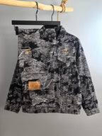 Black-and-white abstract printed long-sleeve jacket with front pockets and button placket