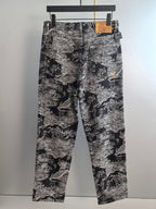 Black-and-white abstract printed long pants shown front view with belt loops