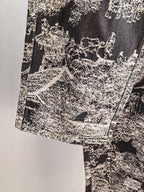 Close-up of black-and-white abstract printed fabric on long pants