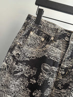 Close-up of black-and-white abstract printed pants front with multiple button pockets