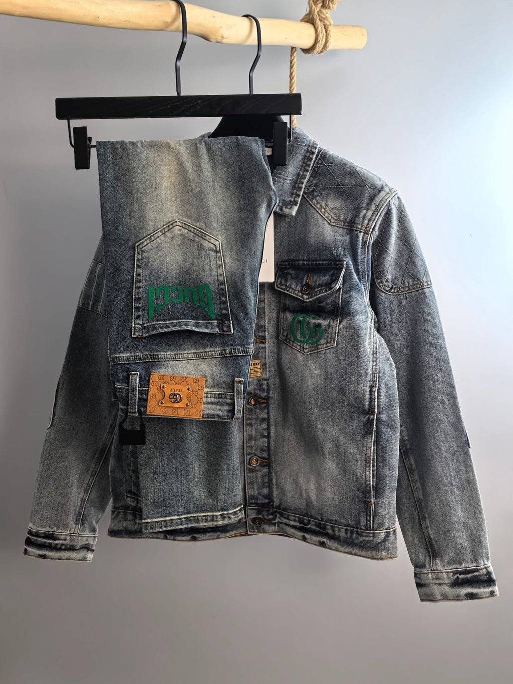 Denim jacket with button front and chest patches, light blue wash