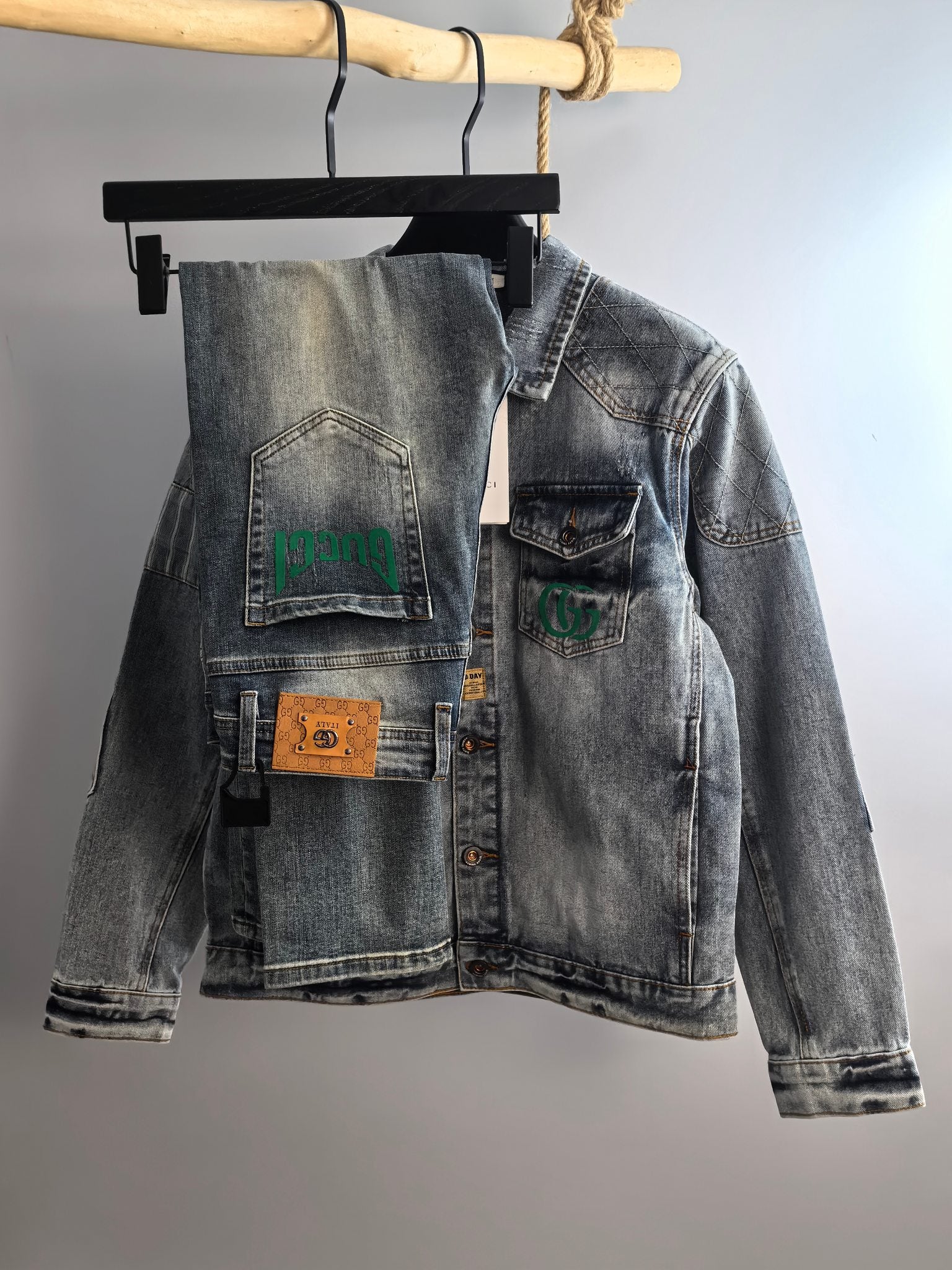 Denim jacket with button front and chest patches, light blue wash