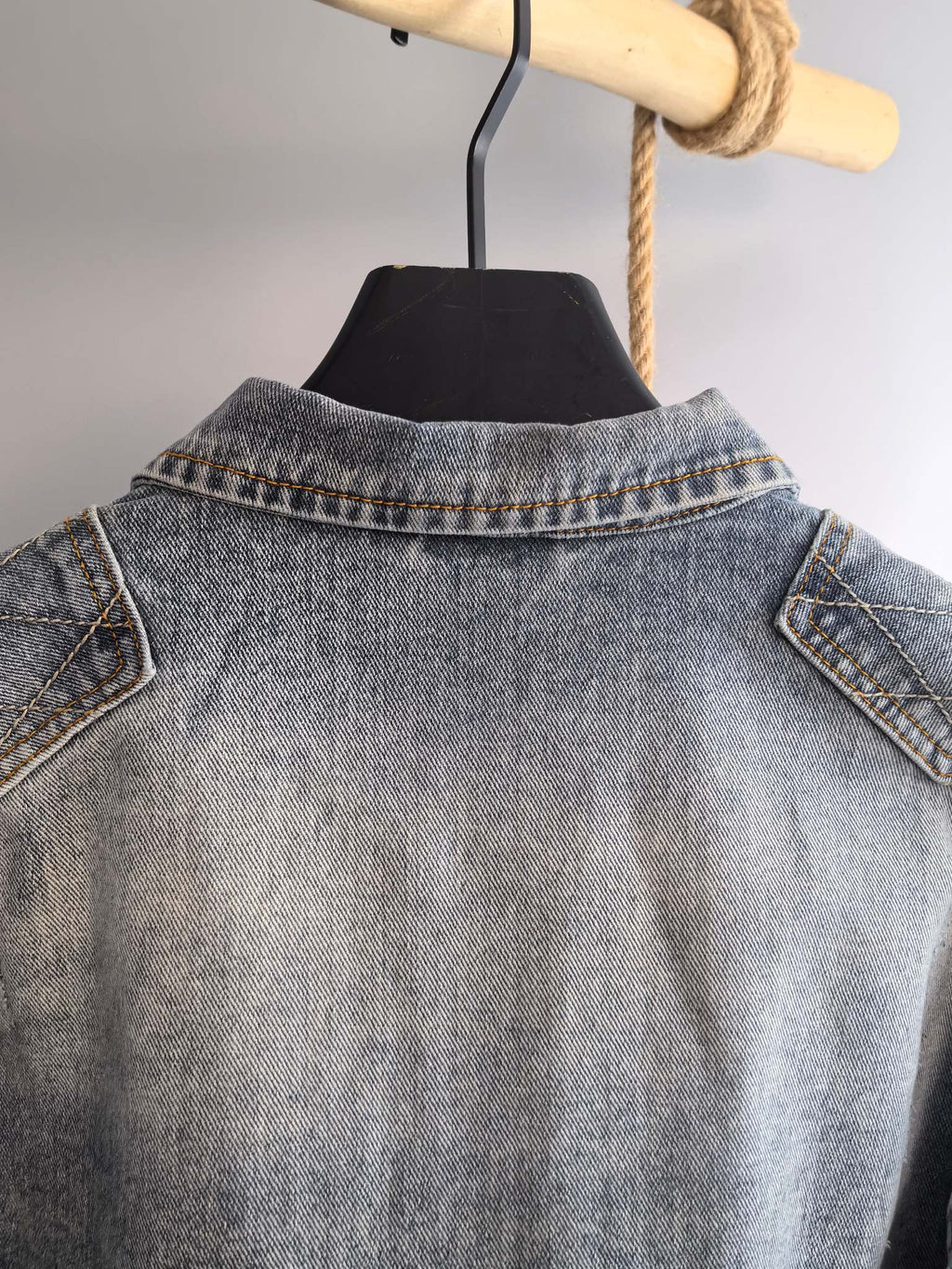 Denim jacket back collar with yoke seam, light blue wash