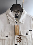 Burberry long-sleeve jacket in white with front emblem, button placket, and flap chest pockets