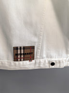 Burberry long-sleeve jacket white with plaid Burberry logo patch near hem and button