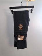 Burberry long pants, black denim with Burberry logo patch and plaid detail inside
