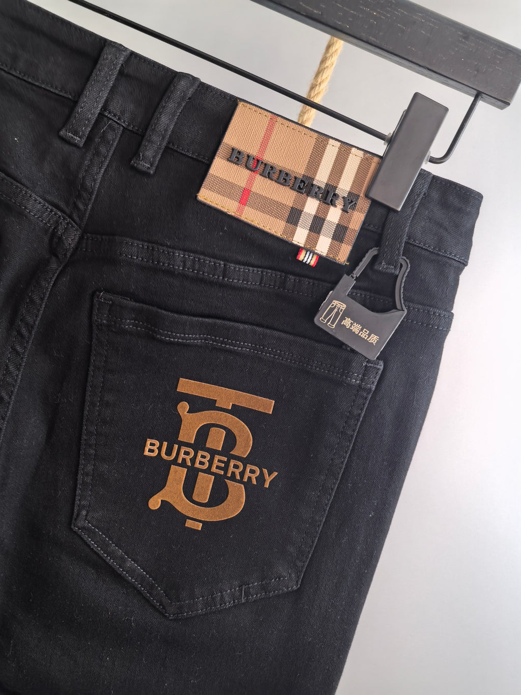 Burberry long pants, black denim back pocket with Burberry logo and plaid label