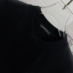 Black short-sleeve T-shirt, crew neck with inner brand label tag