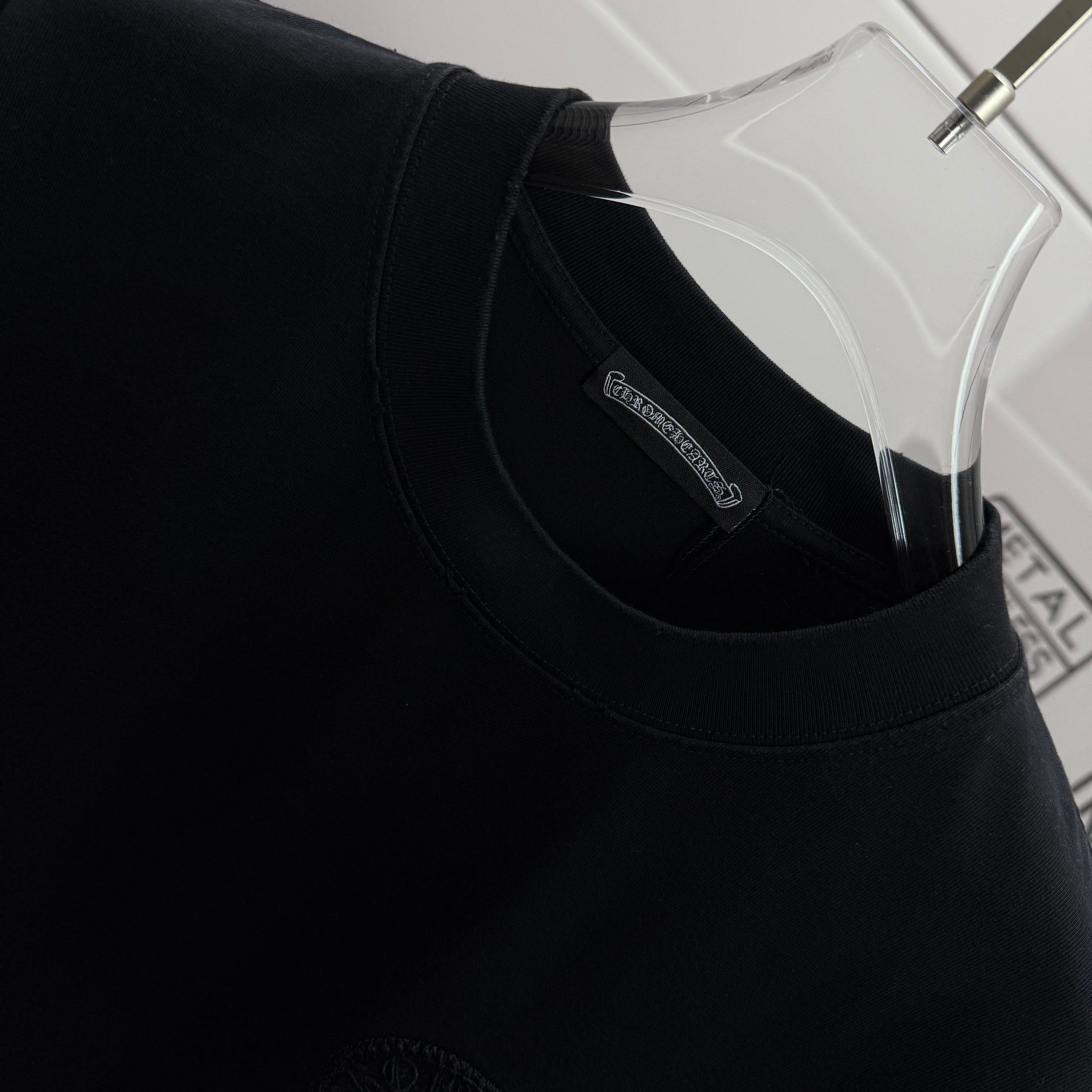 Black short-sleeve T-shirt, crew neck with inner brand label tag