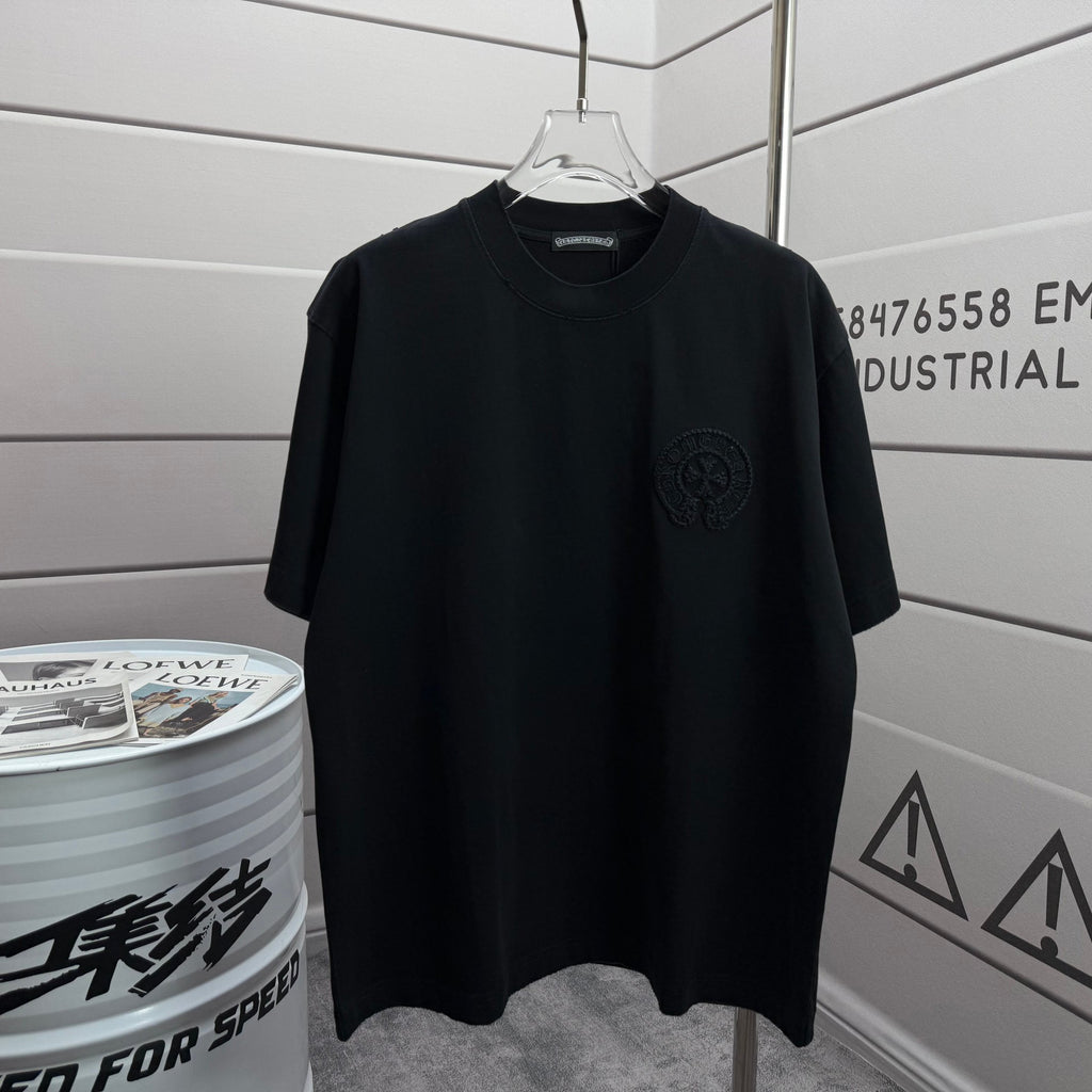 Black short-sleeve T-shirt with small chest logo patch