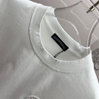 Light crewneck T-shirt neckline with inner brand label and stitched collar.