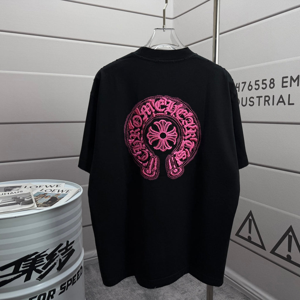 Black short-sleeve T-shirt with pink embroidered circular logo on chest