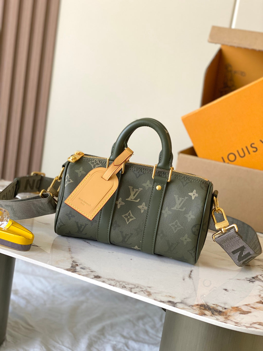 Louis Vuitton green monogram handbag with top handles and gold-tone hardware