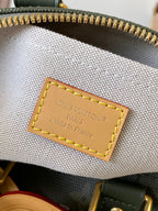 Close-up of white fabric interior panel with Louis Vuitton Paris label and stitching.