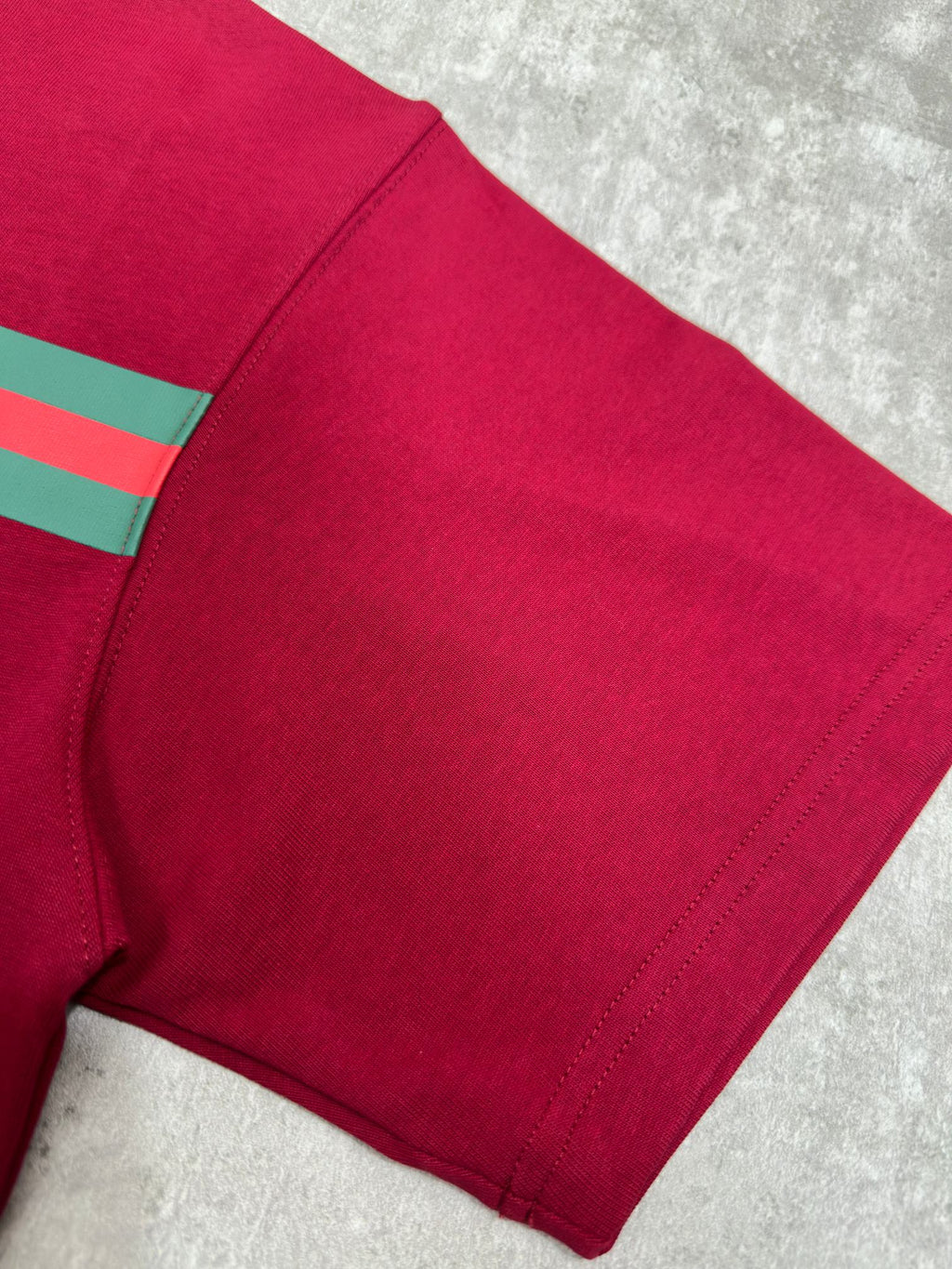 Gucci red T-shirt side seam and hem detail