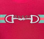 Gucci logo graphic on red T-shirt with green and pink striped band
