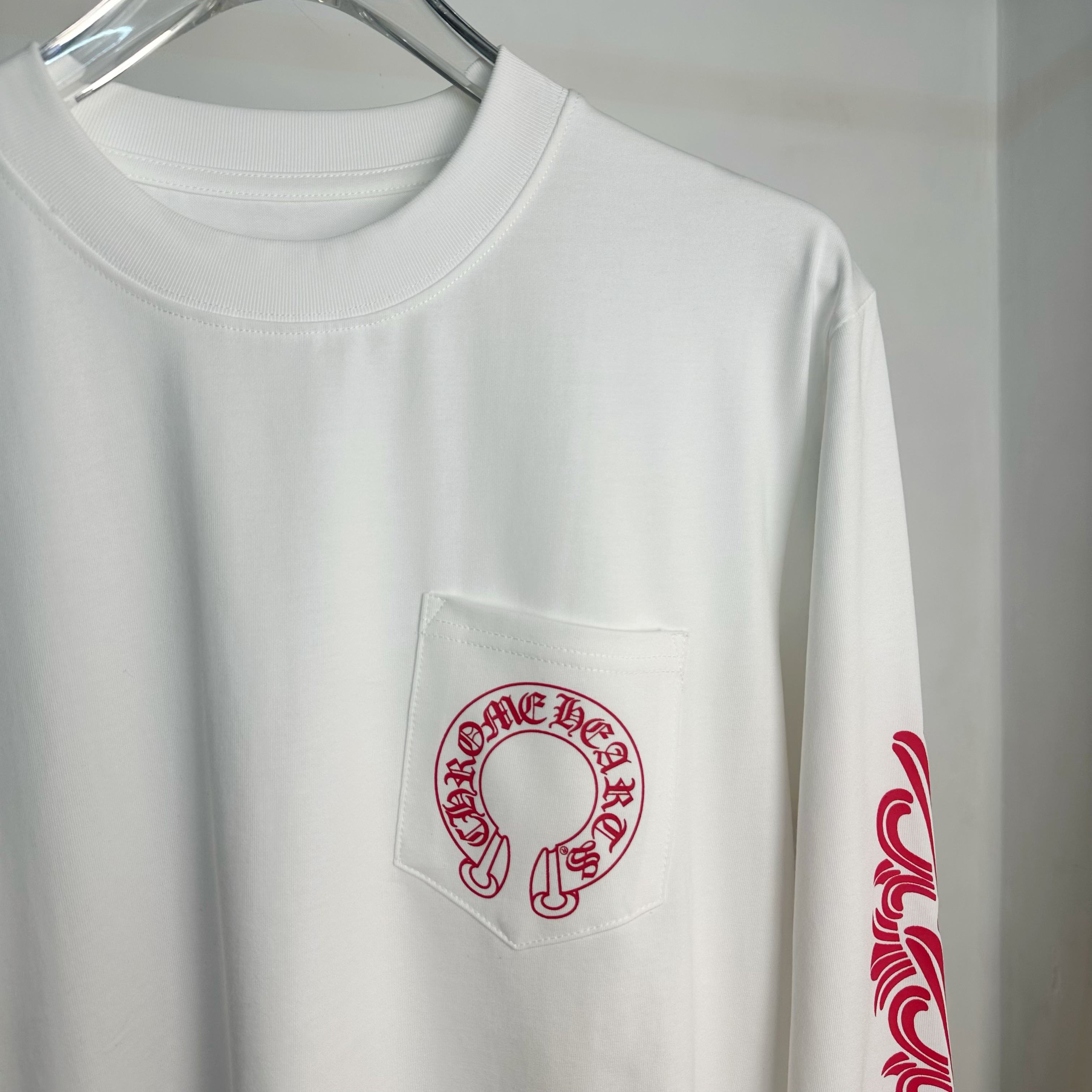 White long-sleeve T-shirt with chest pocket and red circular logo