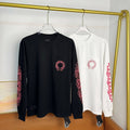 Black long-sleeve T-shirt with red logo graphic on chest
