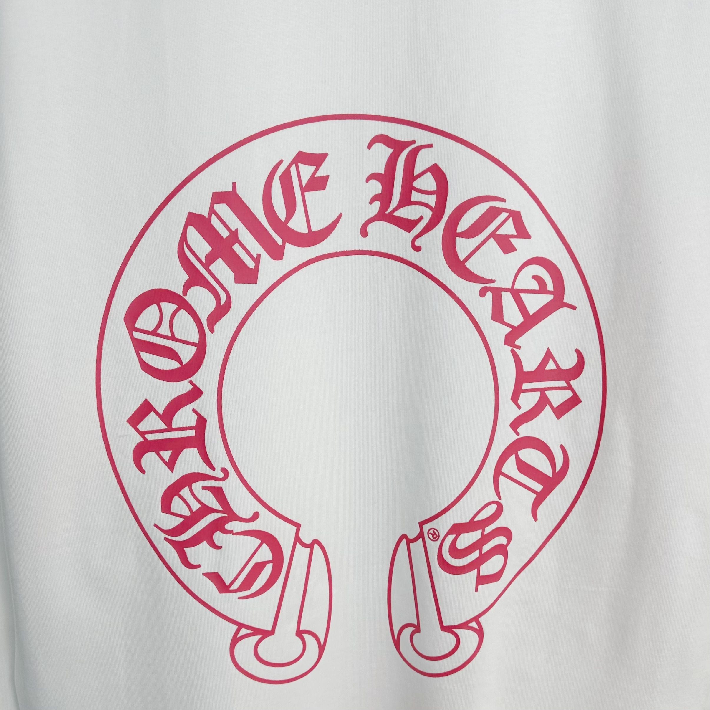 Red circular logo graphic on white long-sleeve T-shirt