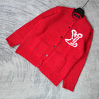 Red knit cardigan with button front and white LV monogram, laid at angle