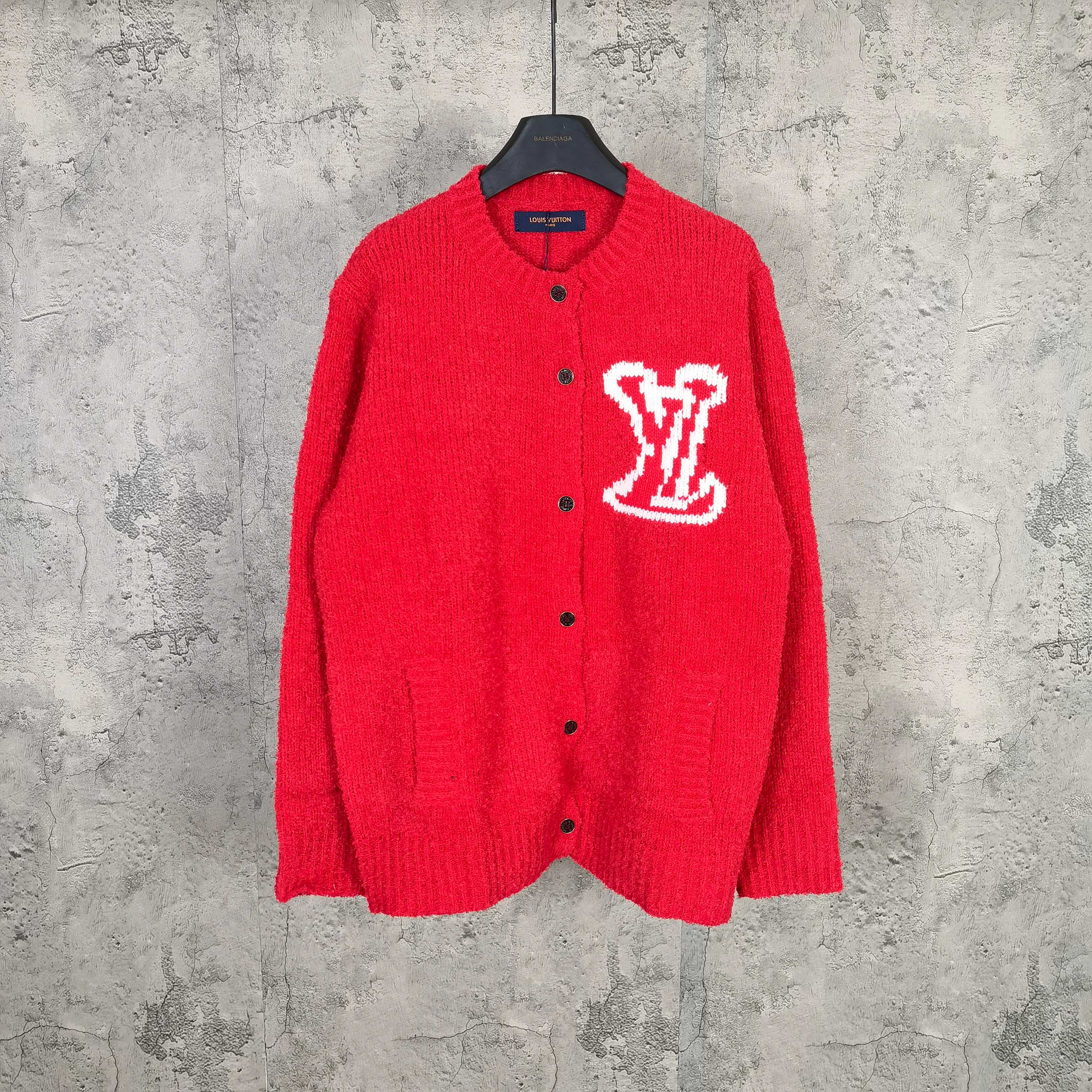 Red long-sleeve knit cardigan with button front and white monogram LV graphic