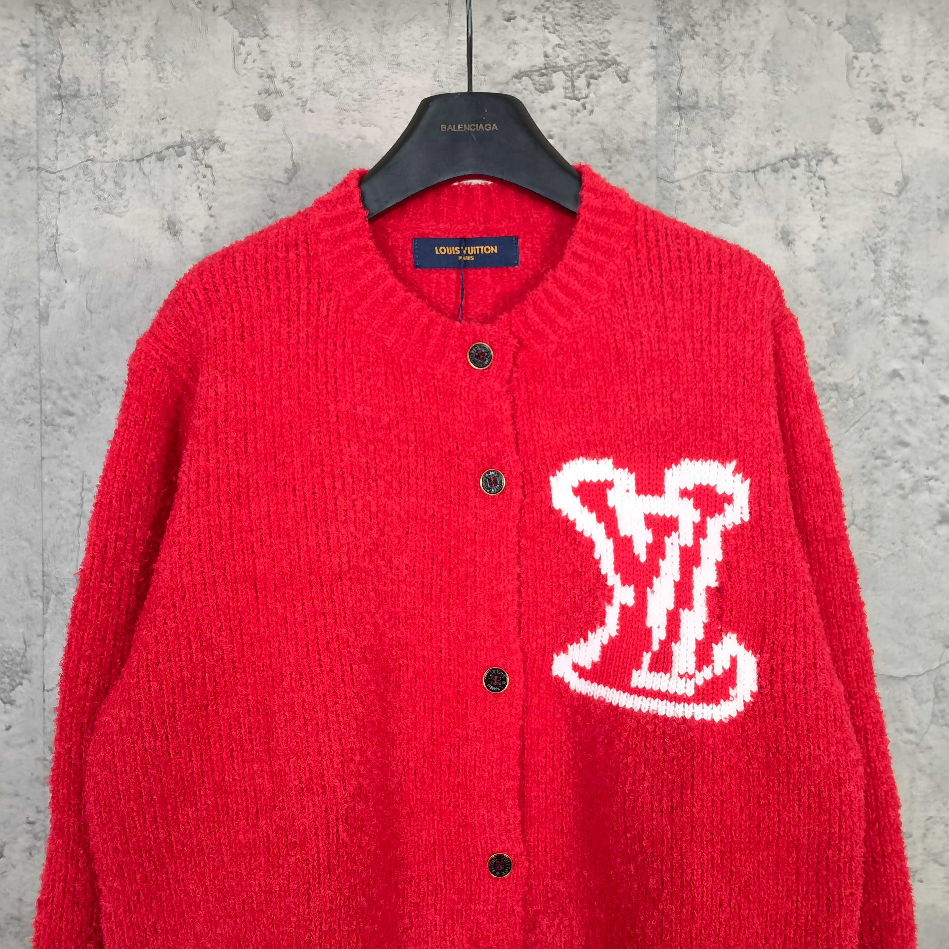Red knit cardigan with button front and large white LV monogram on chest