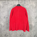 Back view of red long-sleeve knit cardigan on a hanger