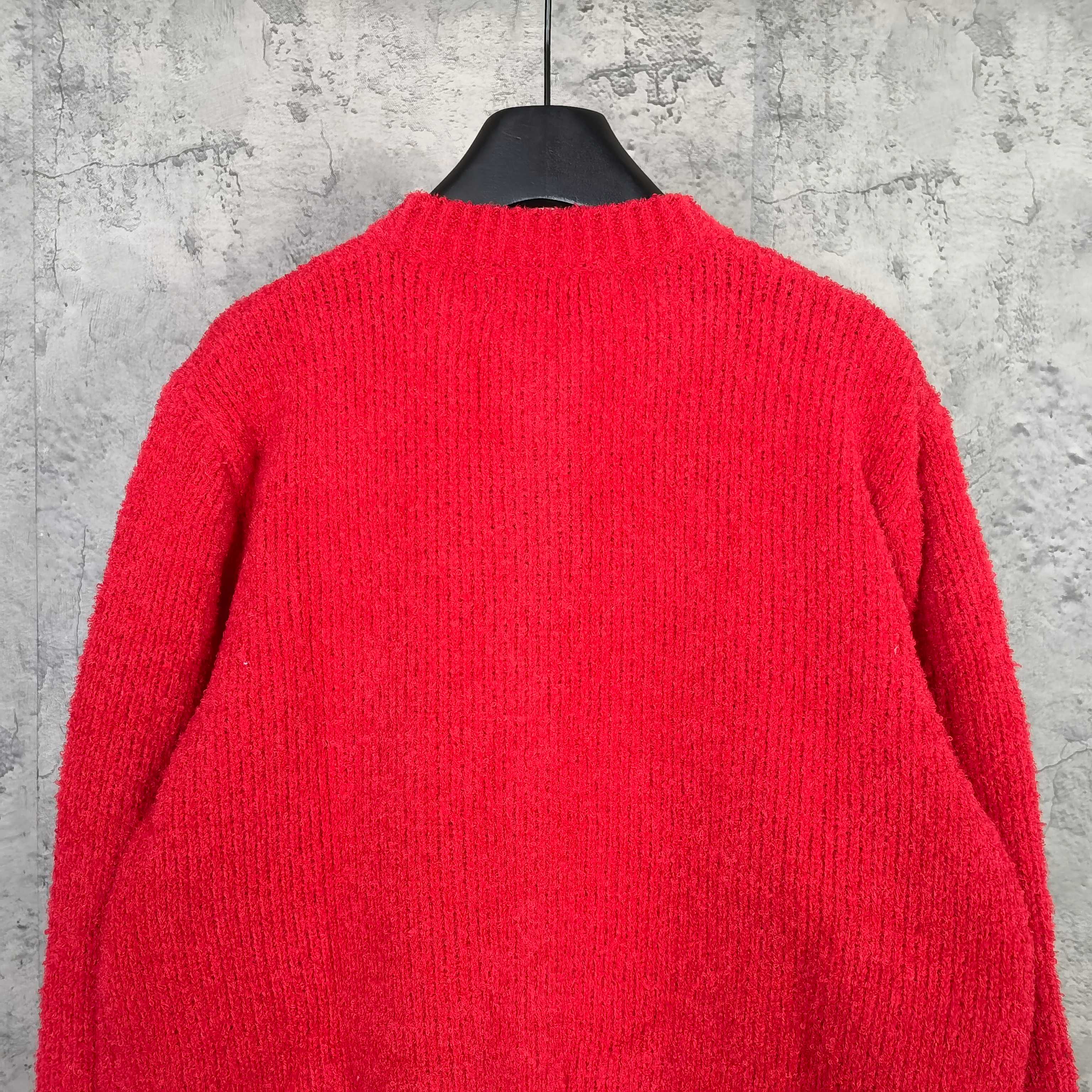 Back of red long-sleeve knit cardigan, plain design on hanger